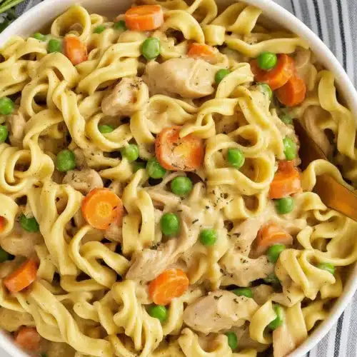 Delicious Chicken Pot Pie Pasta with tender egg noodles and creamy sauce.