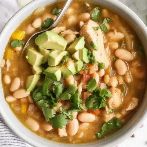 Bowl of creamy White Bean Chicken Chili with chicken and spices.