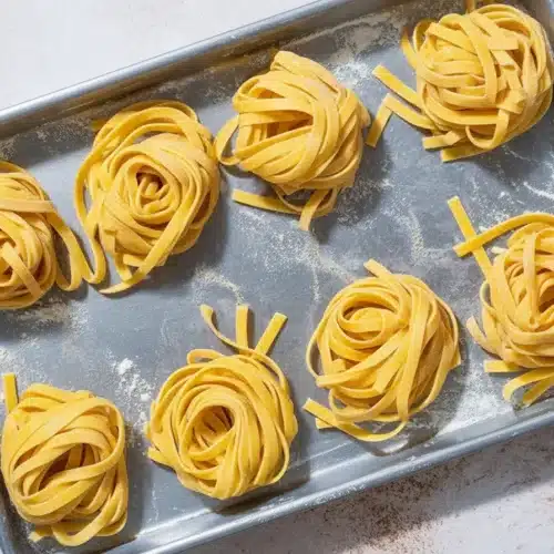A step-by-step guide on how to make fresh pasta from scratch using basic ingredients.